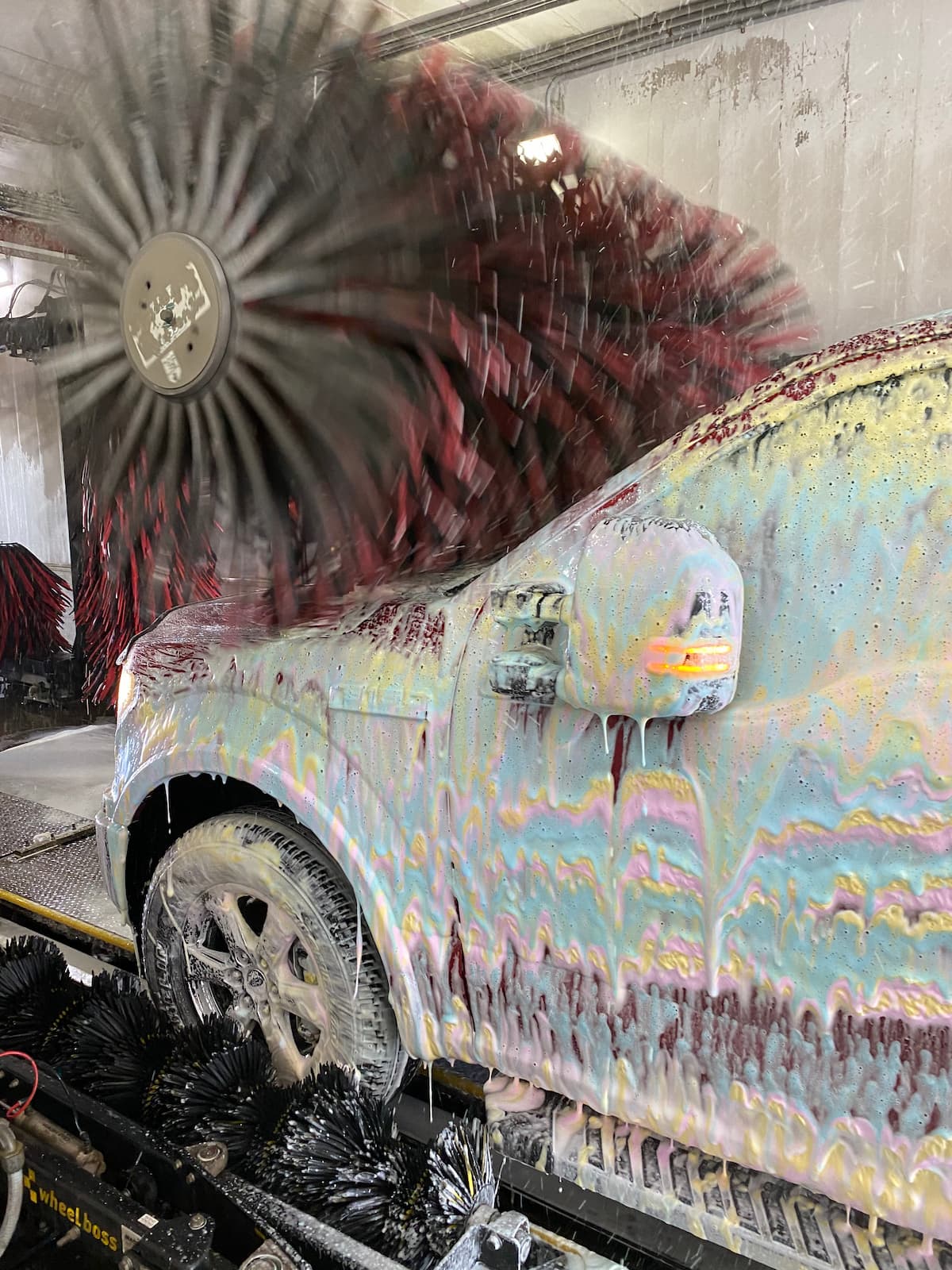 Car going through the wash tunnel at Rowley's Platinum Car Wash